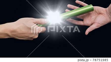 Composition of caucasian athletes passing green relay baton with glowing light Composition of caucasian athletes passing green relay baton with glowing light 78751985