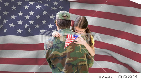 Composition of soldier carrying his daughter holding american flag Composition of soldier carrying his daughter holding american flag 78756544