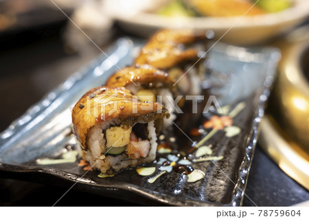 Grilled eel sushi on black plate. Japanese food. 78759604