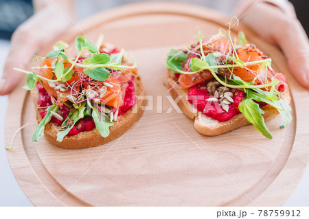 Tasty italian bruschetta on the wooden plate Tasty italian bruschetta on the wooden plate 78759912