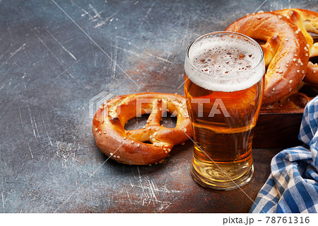 Lager beer mug and fresh baked homemade pretzel 78761316