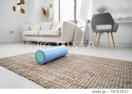 Sport massage roll on a mat indoors 78762917
