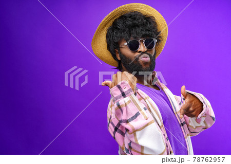 Fashion portrait of african american man in glasses against purple background 78762957