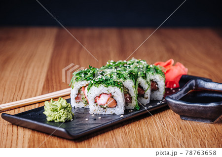 Sushi on a Wooden Table in Restaurant, Delicious Japanese Food, Sushi Rolls 78763658