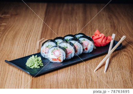 Sushi on a Wooden Table in Restaurant, Delicious Japanese Food, Sushi Rolls 78763695