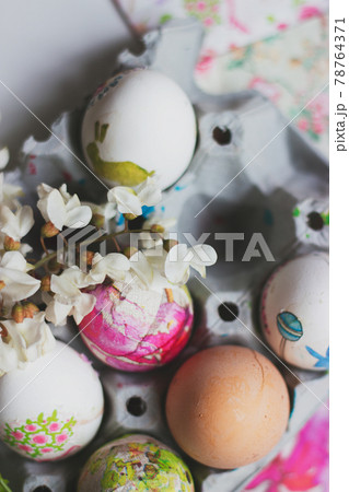 Colorful Easter eggs, in cardboard box, decorated with decoupage technique. Colorful Easter eggs, in cardboard box, decorated with decoupage technique. 78764371