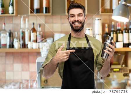 happy barman with shaker preparing happy barman with shaker preparing 78765738