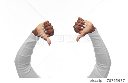 hands of african american woman with thumbs down hands of african american woman with thumbs down 78765977