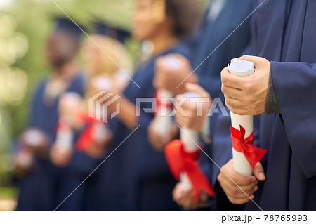 graduate students in mortar boards with diplomas graduate students in mortar boards with diplomas 78765993