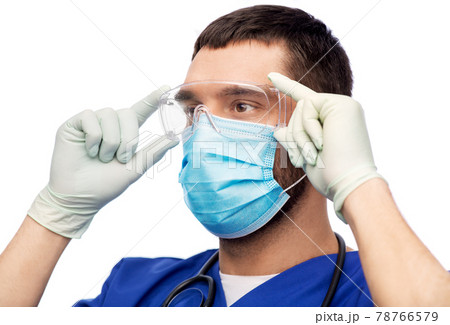 male doctor in goggles, mask and gloves 78766579