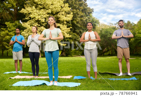 group of people doing yoga at summer park group of people doing yoga at summer park 78766941
