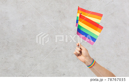 hand with gay pride rainbow flags and wristband hand with gay pride rainbow flags and wristband 78767035