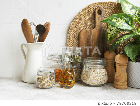 Kitchen utensils, tools and dishware on on the background white tile wall. 78768518