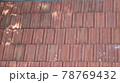 Orange color tile roof background. Close-up of the red clay texture of a house rooftop 78769432