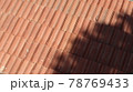 Orange color tile roof background. Close-up of the red clay texture of a house rooftop 78769433