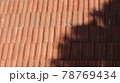 Orange color tile roof background. Close-up of the red clay texture of a house rooftop 78769434