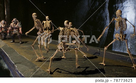 An ancient formidable warrior fights terrible skeletons in a stone castle. The image is designed for military, historical and fantasy backgrounds. 3D Rendering. An ancient formidable warrior fights terrible skeletons in a stone castle. The image is designed for military, historical and fantasy backgrounds. 3D Rendering. 78773625