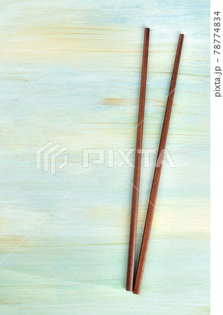 A pair of chopsticks on a blue background with copy space A pair of chopsticks on a blue background with copy space 78774834