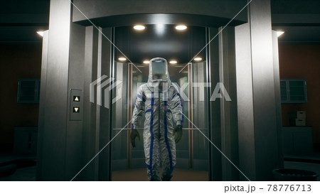 The physicist leaves the elevator and walks down the corridor into the room with the fusion reactor. 3D Rendering. 78776713