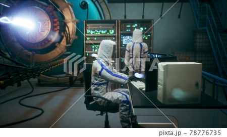 Scientists watch the work of a time machine or a futuristic thermonuclear reactor. A physicist controls a time machine. 3D Rendering. Scientists watch the work of a time machine or a futuristic thermonuclear reactor. A physicist controls a time machine. 3D Rendering. 78776735