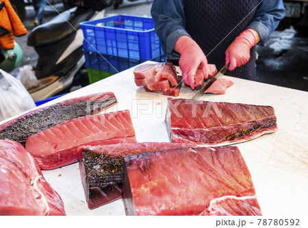 fresh bluefin tuna being cut into slices at the fish market in Kaohsiung, Taiwan. fresh bluefin tuna being cut into slices at the fish market in Kaohsiung, Taiwan. 78780592