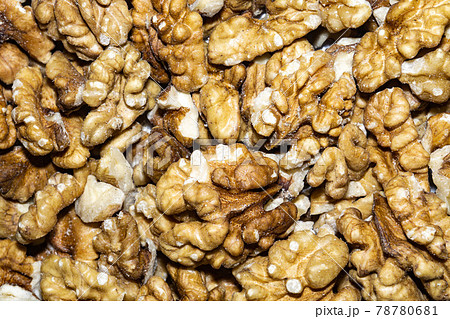 Peeled walnuts background 78780681