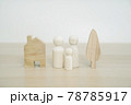 Family wooden peg doll on wood table. Family concept from peg doll. Selective focus. 78785917