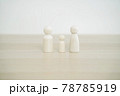 Family wooden peg doll on wood table. Family concept from peg doll. Selective focus. 78785919