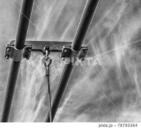 Steel rope of a suspension bridge in front of a blue and white marbled sky, Black and white, bw Steel rope of a suspension bridge in front of a blue and white marbled sky, Black and white, bw 78793364