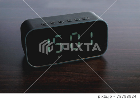 Black Digital alarm clock on background. Black Digital alarm clock on background. 78793924