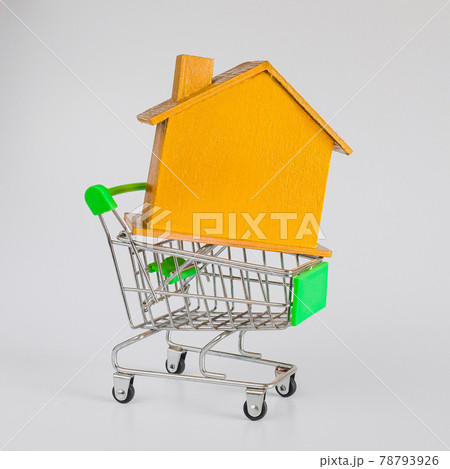 Golden house with shopping cart trolley ,Housing and Real Estate concept. 78793926