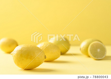 Fresh lemon on yellow color background Fresh lemon on yellow color background 78800043