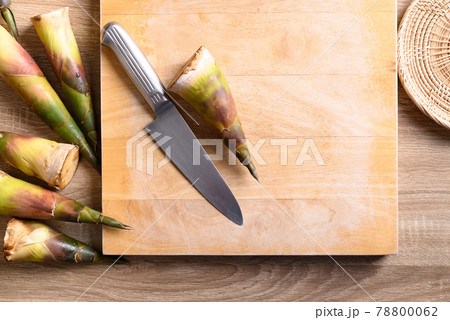 Fresh bamboo shoot prepare for cooking on wooden board and kitchen knife, Asian cuisine Fresh bamboo shoot prepare for cooking on wooden board and kitchen knife, Asian cuisine 78800062