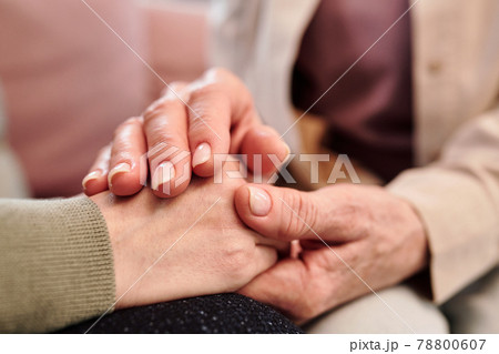 Hands of mature female and her daughter Hands of mature female and her daughter 78800607
