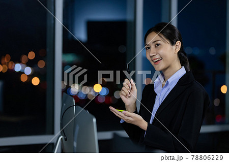 Portrait young business woman at office and write sticky notes for record data. Portrait young business woman at office and write sticky notes for record data. 78806229