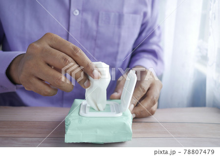 hand pick cleansing wet wipes on table with copy space  78807479