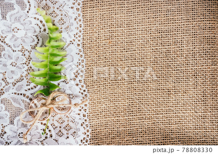 Wedding gold rings on rustic background of lace and burlap. Concept for postcard. 78808330