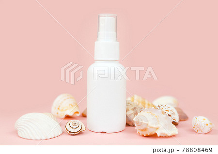 Unbranded white plastic spray bottle and a lot of different sea shells on pink background. Mockup. Skincare beauty and liquid antibacterial spray concept. Mini travel version. Unbranded white plastic spray bottle and a lot of different sea shells on pink background. Mockup. Skincare beauty and liquid antibacterial spray concept. Mini travel version. 78808469