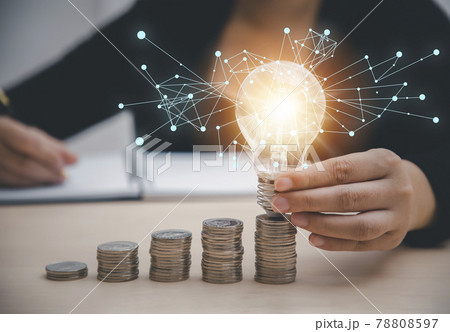 Business hand-holding light bulbs and working on the desk, Creativity, and innovation are keys to success. Concept of new idea and innovation with Brain and light bulbs, working at home. Business hand-holding light bulbs and working on the desk, Creativity, and innovation are keys to success. Concept of new idea and innovation with Brain and light bulbs, working at home. 78808597