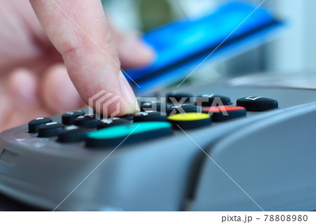 Customer using blue credit card to pay. 78808980