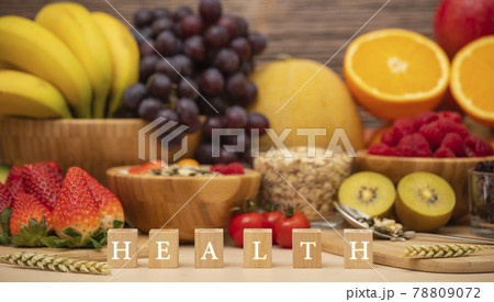 Group Fruits mixed with banana, orange, strawberry and nuts, concept health food and diet, vegetarian food in the top view on the wood table. 78809072