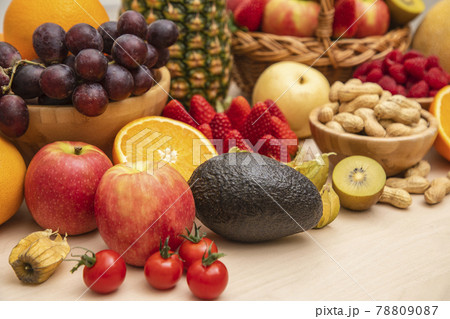 Group Fruits mixed with banana, orange, strawberry and nuts, concept health food and diet, vegetarian food in the top view on the wood table. 78809087