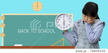 Back to school and Time and daily life concept, Happy Asian little girl hand holding a big clock time 6 am in the morning with a writing board in the blue background, Copy space, Clipping path. Back to school and Time and daily life concept, Happy Asian little girl hand holding a big clock time 6 am in the morning with a writing board in the blue background, Copy space, Clipping path. 78809240