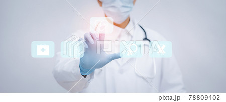 Close Up doctor or scientist in uniform wearing face mask with a stethoscope Touch medical icon graph on the white background, Healthcare And Medical concept,medicine and people. Close Up doctor or scientist in uniform wearing face mask with a stethoscope Touch medical icon graph on the white background, Healthcare And Medical concept,medicine and people. 78809402