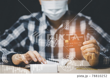 Credit card debt from Covid-19 concept, Asian men use the hand to hold the credit cards from bank debt and strain, unplanned spending, unemployment and economic losses. Credit card debt from Covid-19 concept, Asian men use the hand to hold the credit cards from bank debt and strain, unplanned spending, unemployment and economic losses. 78810252