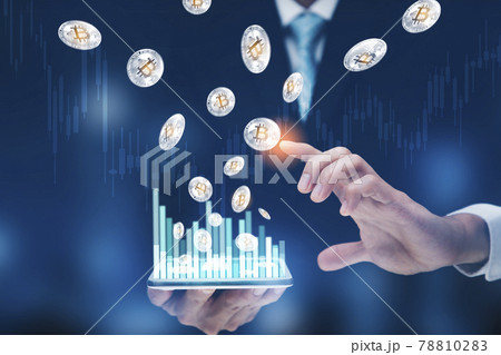 Businessman holding tablet bar graph of analytics and financial and bitcoin as part of a business network on blue background. bitcoin cryptocurrency ideas concept and virtual financial chart diagram, 78810283