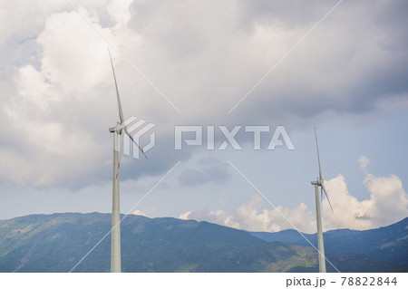 Wind power plant. green meadow with Wind turbines generating electricity Wind power plant. green meadow with Wind turbines generating electricity 78822844