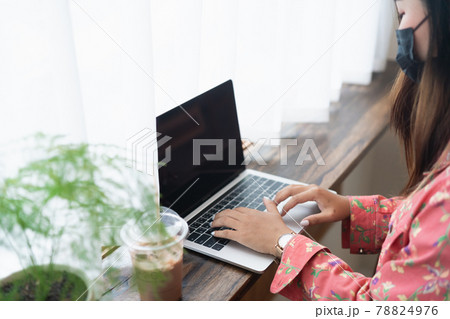 Female graphic designer artist using laptop working in windowsill at the cafe Female graphic designer artist using laptop working in windowsill at the cafe 78824976