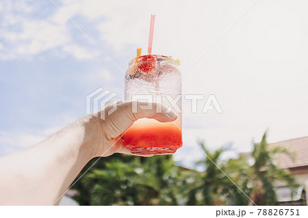 Mixed Fruits Pink Italian soda against sunny sky of summer. Mixed Fruits Pink Italian soda against sunny sky of summer. 78826751