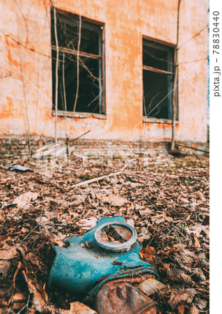 Gasmask Near Abandoned Ruined Old Village School Building In Chernobyl Resettlement Zone. Belarus. Chornobyl Catastrophe Disasters. Dilapidated House In Belarusian Village. Whole Villages Must Be 78830440